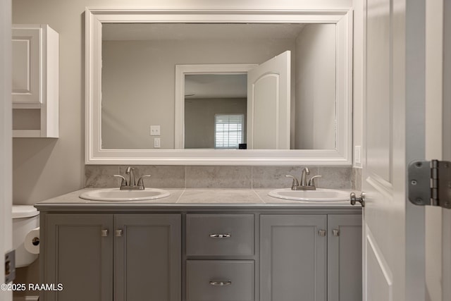 310 Harvest Ln, Abbeville, LA 70510 - bathroom featuring double vanity and toilet