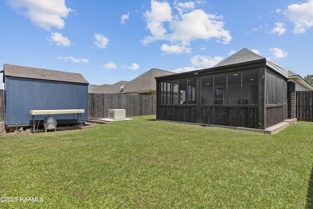 310 Harvest Ln, Abbeville, LA 70510 - fenced backyard with a sunroom