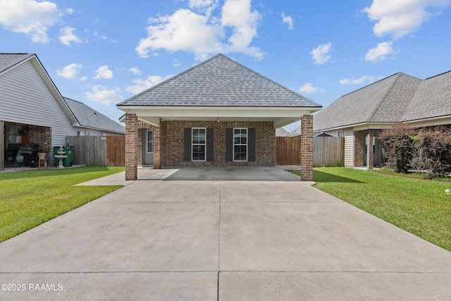 310 Harvest Ln, Abbeville, LA 70510 - view of front of home with brick siding, roof with shingles, and driveway