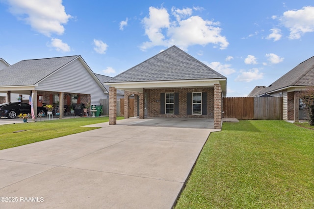310 Harvest Ln, Abbeville, LA 70510 - view of front of house featuring brick siding, a shingled roof, and driveway