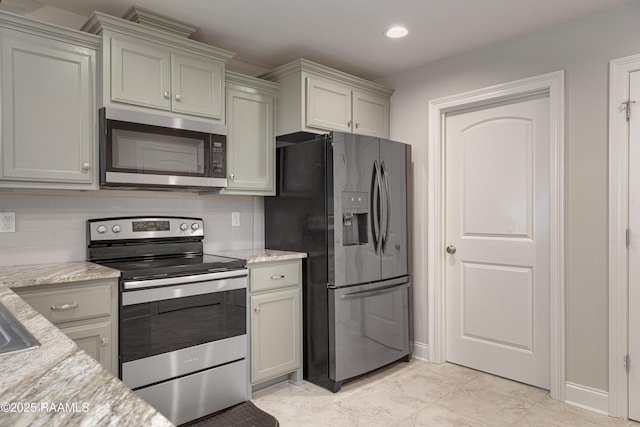 310 Harvest Ln, Abbeville, LA 70510 - kitchen featuring stainless steel appliances, decorative backsplash, recessed lighting, and light stone countertops