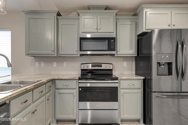 310 Harvest Ln, Abbeville, LA 70510 - kitchen with stainless steel appliances, decorative backsplash, and light stone counters