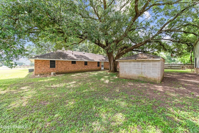 1530 S Fieldspan Rd, Duson, LA 70529 - back of property with an outdoor structure and brick siding