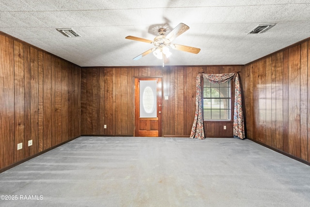 1530 S Fieldspan Rd, Duson, LA 70529 - carpeted empty room with wood walls and ceiling fan