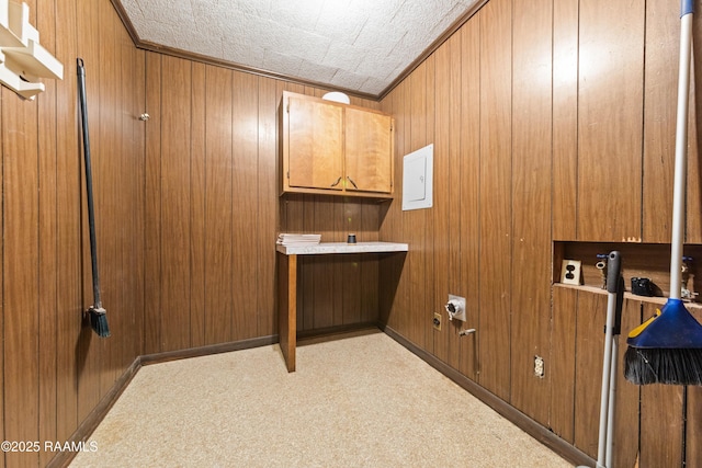1530 S Fieldspan Rd, Duson, LA 70529 - washroom featuring cabinet space, light colored carpet, and wood walls