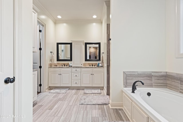 105 Cane Creek Dr, Broussard, LA 70518 - bathroom featuring double vanity, a garden tub, ornamental molding, and recessed lighting