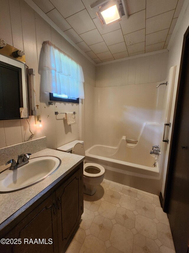 2115 Vige St, Opelousas, LA 70570 - bathroom featuring toilet, vanity, bathing tub / shower combination, and tile patterned floors