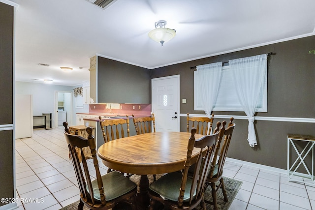 938 Marteau Rd, Broussard, LA 70518 - dining area featuring light tile patterned flooring and washer / clothes dryer