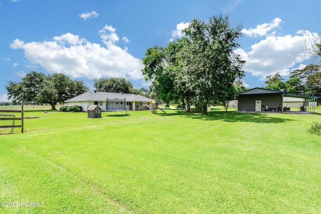 938 Marteau Rd, Broussard, LA 70518 - view of grassy yard with a carport
