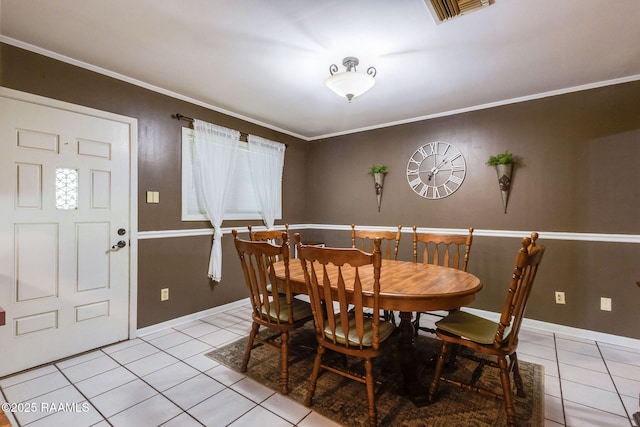 938 Marteau Rd, Broussard, LA 70518 - dining area featuring light tile patterned floors, ornamental molding, and baseboards
