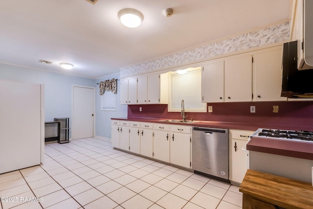 938 Marteau Rd, Broussard, LA 70518 - kitchen with dishwasher, a sink, dark countertops, freestanding refrigerator, and light tile patterned floors