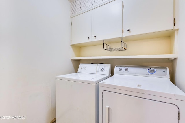 938 Marteau Rd, Broussard, LA 70518 - laundry area featuring washer and dryer and cabinet space