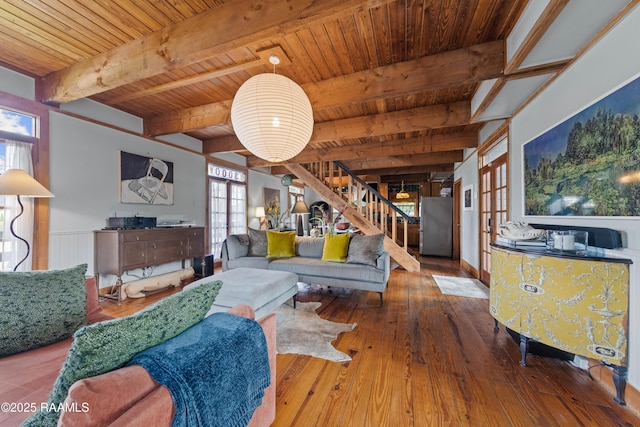 3000 E Simcoe St, Lafayette, LA 70501 - living room featuring wood ceiling with exposed beams, plenty of natural light, stairs, hardwood / wood-style floors, and french doors