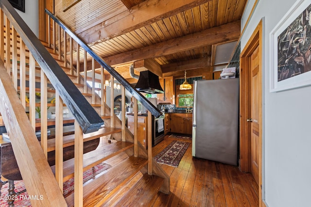 3000 E Simcoe St, Lafayette, LA 70501 - stairs featuring hardwood / wood-style floors and wooden ceiling with exposed beams