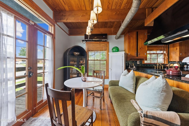 3000 E Simcoe St, Lafayette, LA 70501 - dining room with a wood ceiling with exposed beams, light wood-style floors, and a wall mounted AC