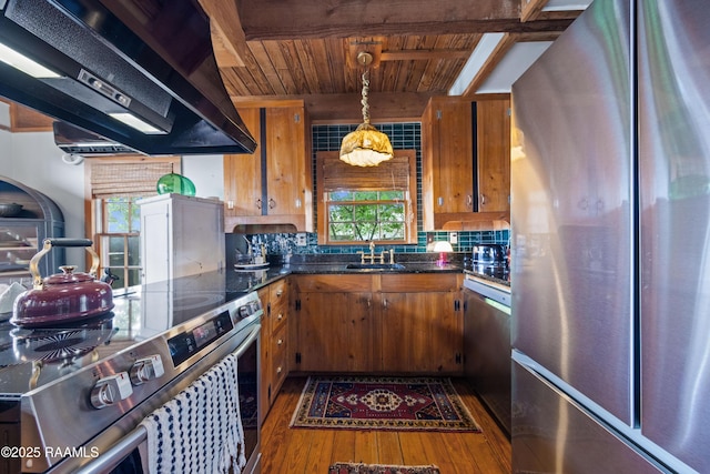 3000 E Simcoe St, Lafayette, LA 70501 - kitchen featuring appliances with stainless steel finishes, ventilation hood, wood ceiling, wood-type flooring, and healthy amount of natural light