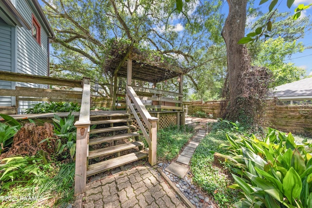 3000 E Simcoe St, Lafayette, LA 70501 - fenced backyard featuring stairs and a wooden deck