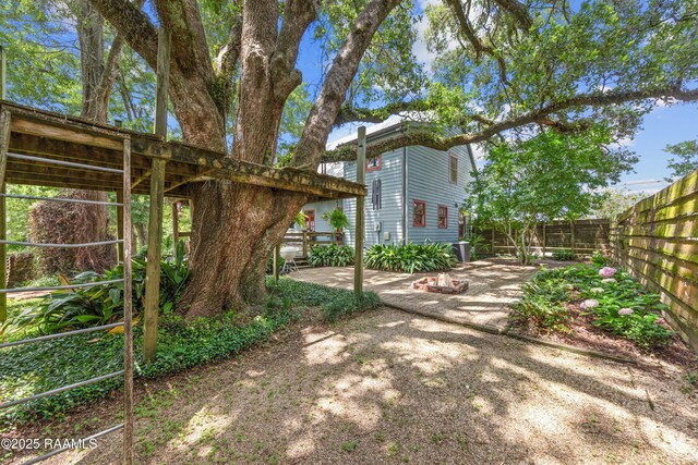 3000 E Simcoe St, Lafayette, LA 70501 - fenced backyard with a patio