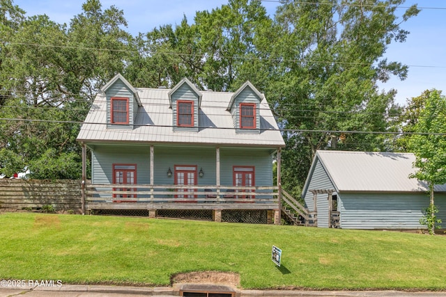 3000 E Simcoe St, Lafayette, LA 70501 - cape cod home featuring a front yard, a porch, a gambrel roof, and french doors
