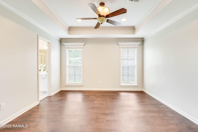 117 Fawn Ln, Broussard, LA 70518 - spare room featuring dark wood-style flooring, a tray ceiling, ornamental molding, and a ceiling fan