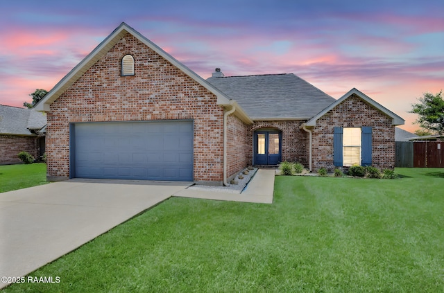 117 Fawn Ln, Broussard, LA 70518 - view of front of home featuring concrete driveway, an attached garage, a shingled roof, and brick siding