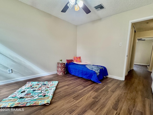 201 High Meadows Blvd Unit 205, Lafayette, LA 70507 - bedroom with wood finished floors, baseboards, a textured ceiling, ceiling fan, and attic access