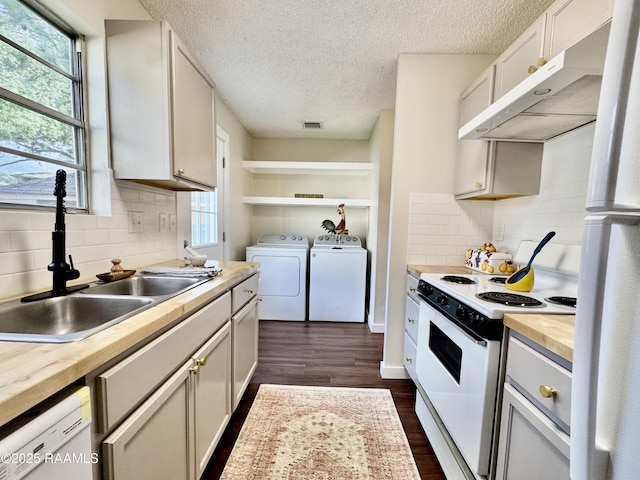 201 High Meadows Blvd Unit 205, Lafayette, LA 70507 - kitchen with washer and dryer, white appliances, wooden counters, a sink, and under cabinet range hood
