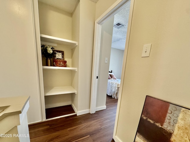 201 High Meadows Blvd Unit 205, Lafayette, LA 70507 - hall with dark wood-style flooring and baseboards