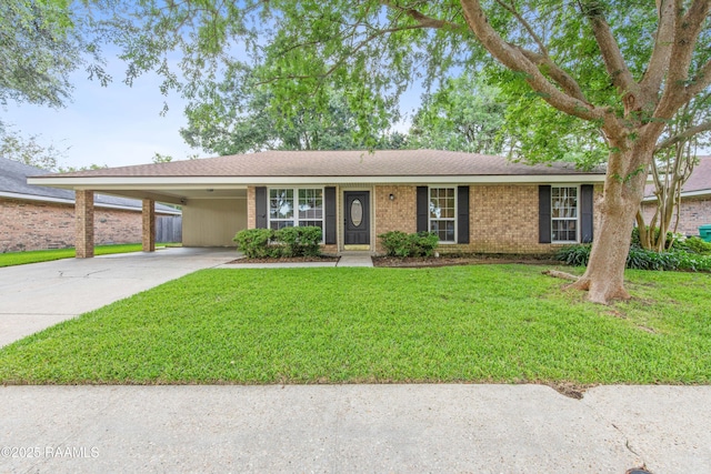 315 Orgeron Dr, Lafayette, LA 70506 - ranch-style home with driveway, a carport, a front lawn, and brick siding