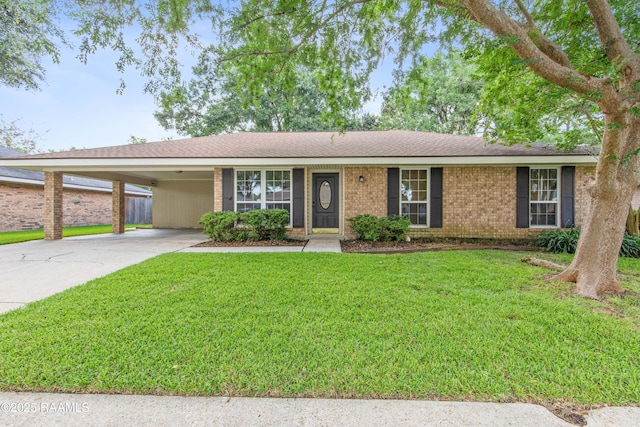 315 Orgeron Dr, Lafayette, LA 70506 - ranch-style home featuring an attached carport, a front lawn, concrete driveway, and brick siding