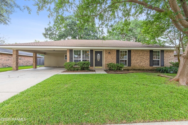 315 Orgeron Dr, Lafayette, LA 70506 - single story home with an attached carport, concrete driveway, a front lawn, and brick siding