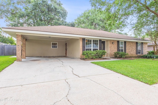 315 Orgeron Dr, Lafayette, LA 70506 - ranch-style home featuring driveway, brick siding, and an attached carport