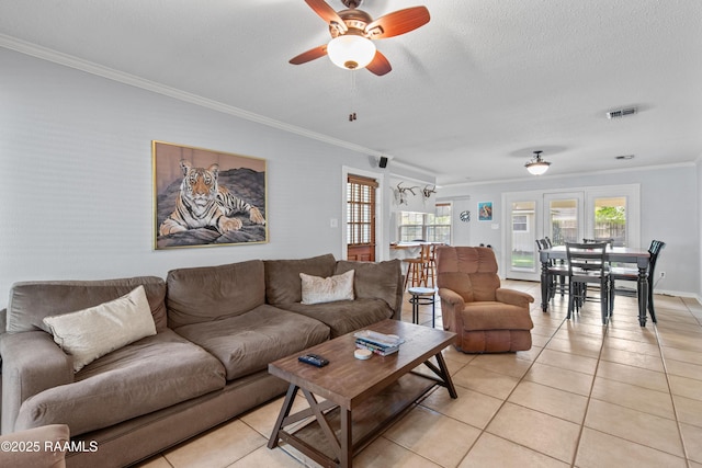 315 Orgeron Dr, Lafayette, LA 70506 - living area with ornamental molding, light tile patterned floors, ceiling fan, and a textured ceiling