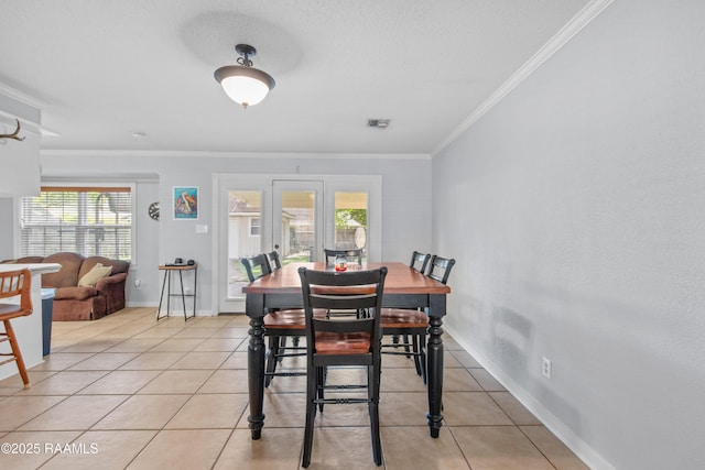 315 Orgeron Dr, Lafayette, LA 70506 - dining area featuring plenty of natural light, crown molding, and light tile patterned floors