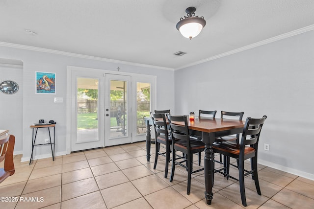 315 Orgeron Dr, Lafayette, LA 70506 - dining space featuring crown molding, french doors, and light tile patterned flooring