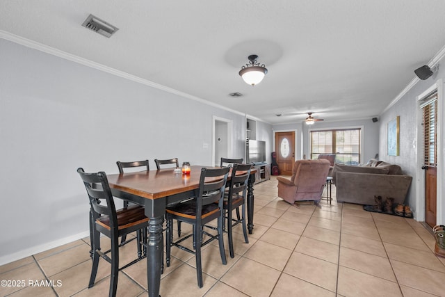 315 Orgeron Dr, Lafayette, LA 70506 - dining area featuring ornamental molding, light tile patterned floors, and a ceiling fan