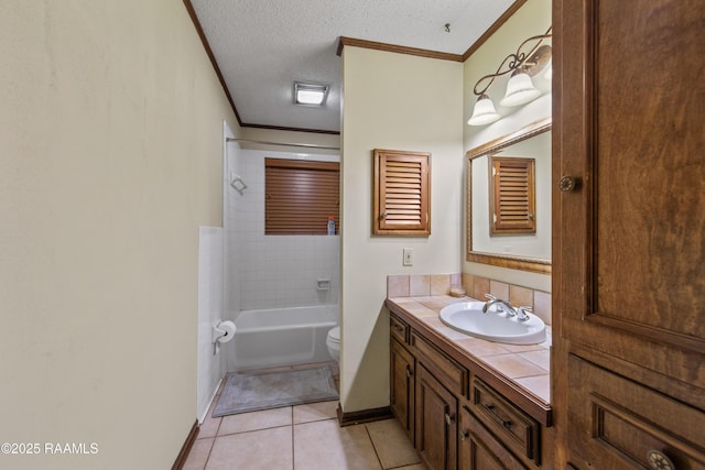 315 Orgeron Dr, Lafayette, LA 70506 - full bath with ornamental molding, vanity, tile patterned floors, a textured ceiling, and bathing tub / shower combination