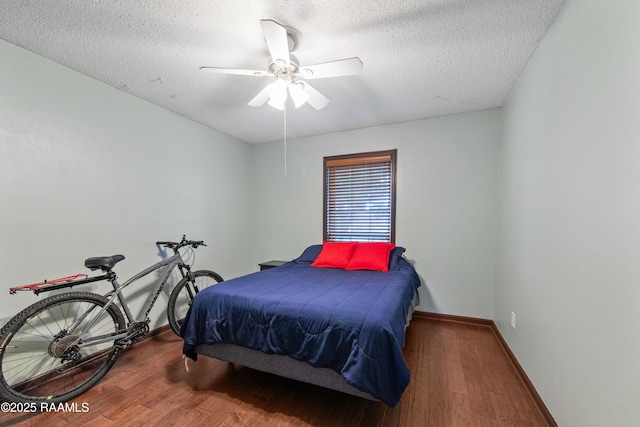 315 Orgeron Dr, Lafayette, LA 70506 - bedroom with wood finished floors, a textured ceiling, and a ceiling fan