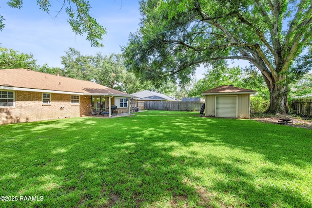 315 Orgeron Dr, Lafayette, LA 70506 - fenced backyard with a fire pit, a storage shed, and a patio area