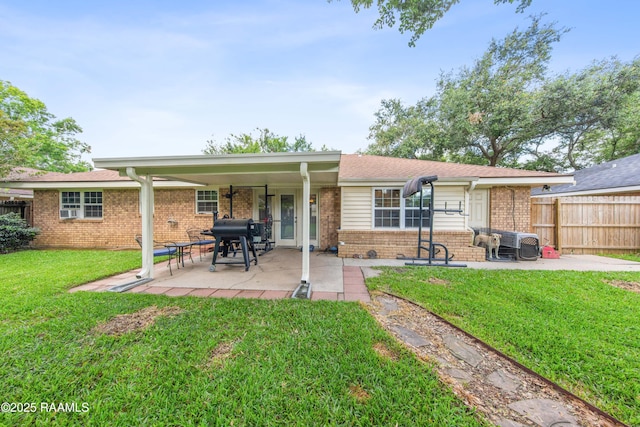 315 Orgeron Dr, Lafayette, LA 70506 - rear view of property featuring brick siding and a patio area