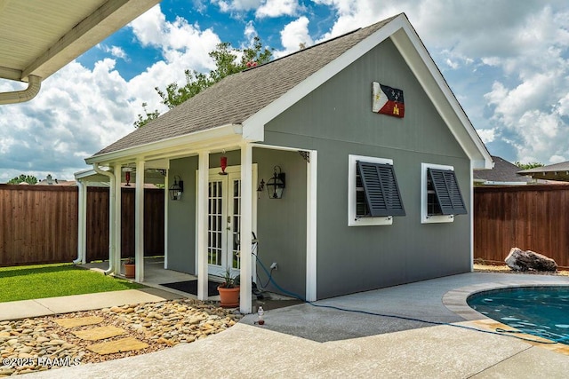 202 Doe Ln, Broussard, LA 70518 - view of outdoor structure featuring french doors and a fenced backyard
