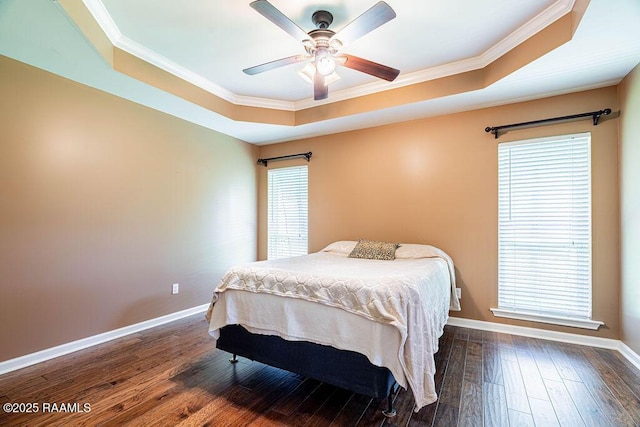 202 Doe Ln, Broussard, LA 70518 - bedroom featuring a tray ceiling, ornamental molding, dark wood-style flooring, and a ceiling fan