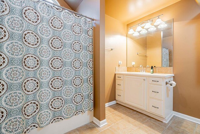 202 Doe Ln, Broussard, LA 70518 - bathroom featuring vanity and tile patterned flooring