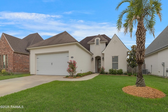 302 Easy Rock Landing Dr, Broussard, LA 70518 - french country style house featuring driveway, a front lawn, a garage, and stucco siding