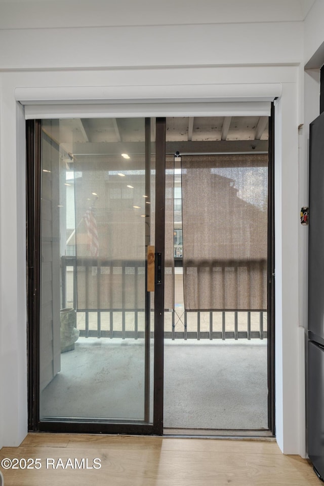 1304 E Bayou Pkwy Unit 8A, Lafayette, LA 70508 - doorway featuring healthy amount of natural light and wood finished floors