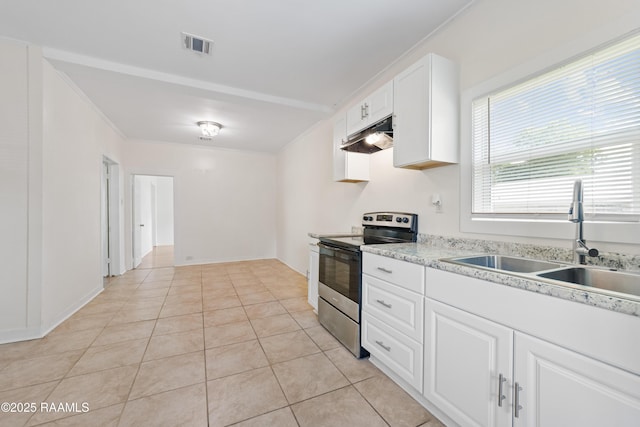708 Park Ave, Breaux Bridge, LA 70517 - kitchen featuring electric range, light countertops, white cabinetry, light tile patterned flooring, and under cabinet range hood