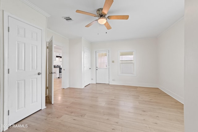 708 Park Ave, Breaux Bridge, LA 70517 - empty room with ornamental molding, a ceiling fan, and light wood-type flooring