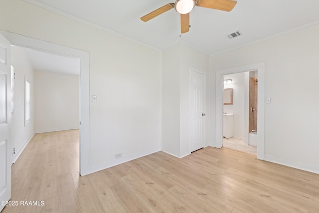708 Park Ave, Breaux Bridge, LA 70517 - unfurnished room featuring crown molding, ceiling fan, light wood-style flooring, and washer / dryer