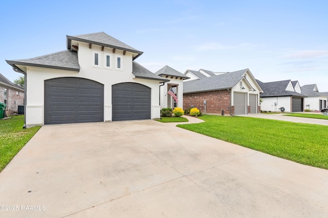 236 Whispering Meadows Rd, Broussard, LA 70518 - french country style house featuring a front lawn, a shingled roof, driveway, and stucco siding