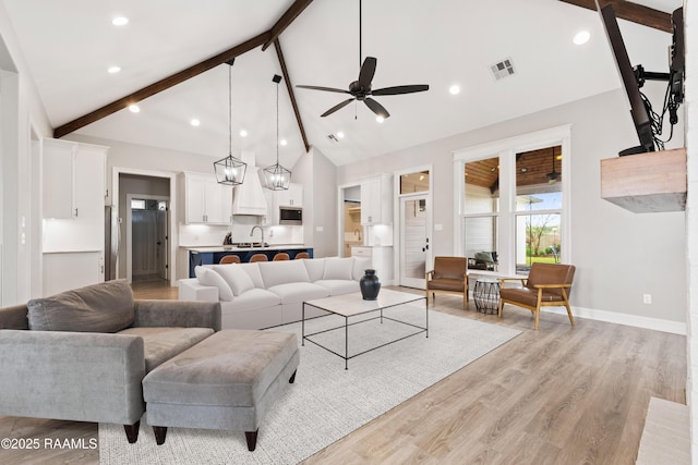 236 Whispering Meadows Rd, Broussard, LA 70518 - living room featuring ceiling fan, beamed ceiling, light wood-style flooring, high vaulted ceiling, and recessed lighting